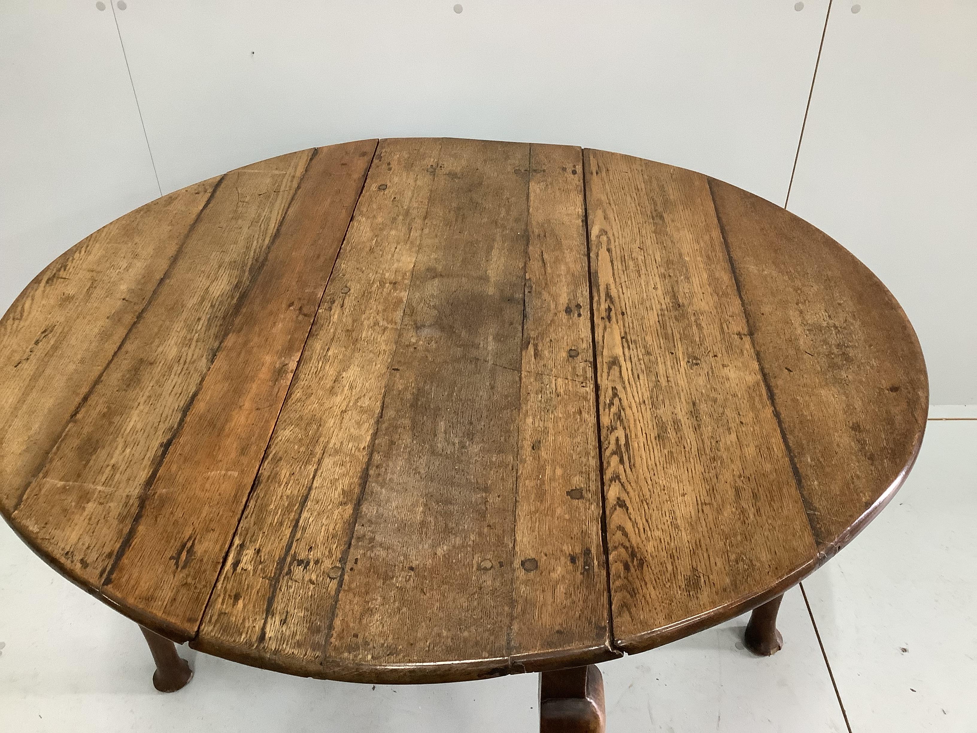 An 18th century provincial oak drop leaf pad foot table, width 104cm, depth 38cm, height 71cm